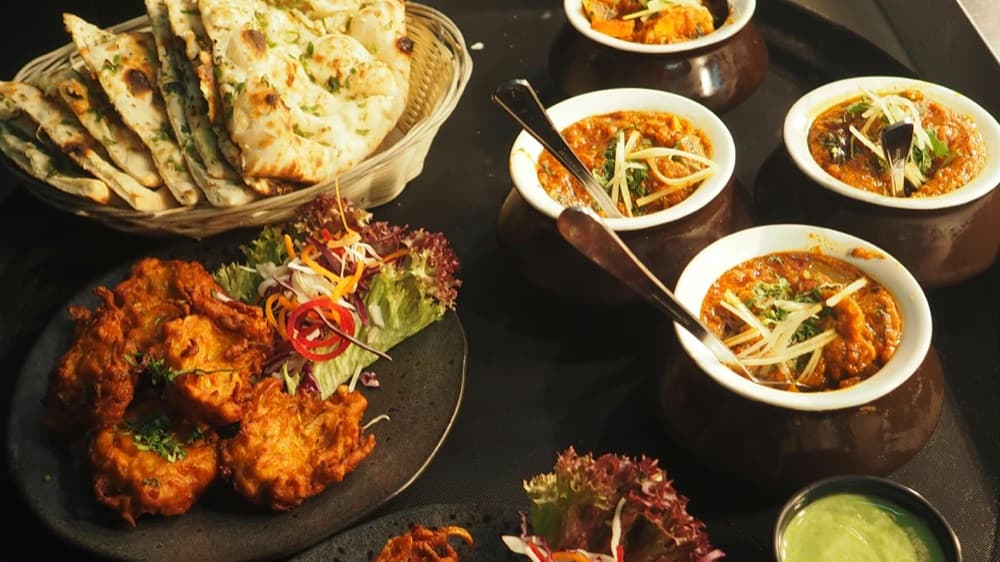 Curry Trio with Naan and Pakoras